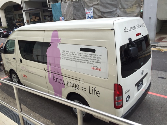An Action for Aids mobile testing van, parked outside DSC Clinic.